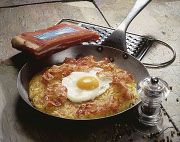 Fried potato with bacon and fried egg